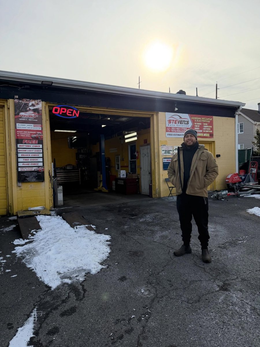 Steven in front of Stevens Auto Services in Garfield
