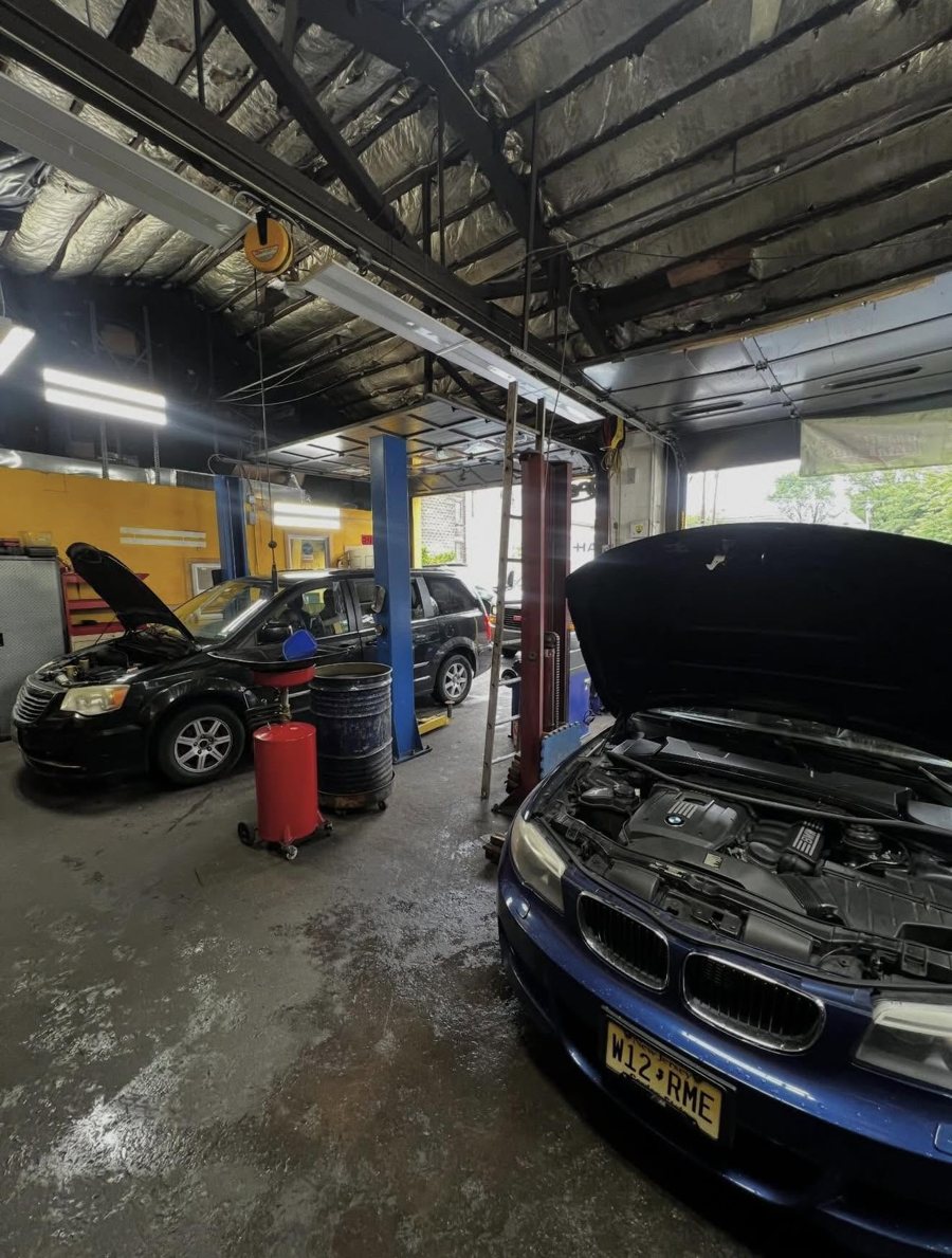 BMW with the hood open mid-repair